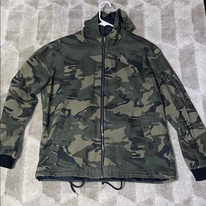 Camo zip trench with jaw string bottom.